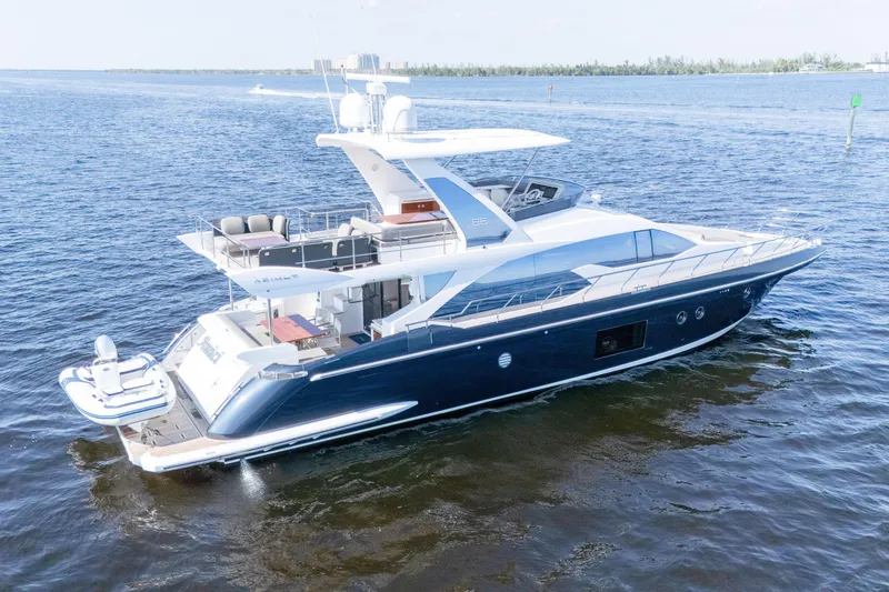 Slide: The Image of 2017 Azimut 66 Flybridge yacht cruising on open water. - 3