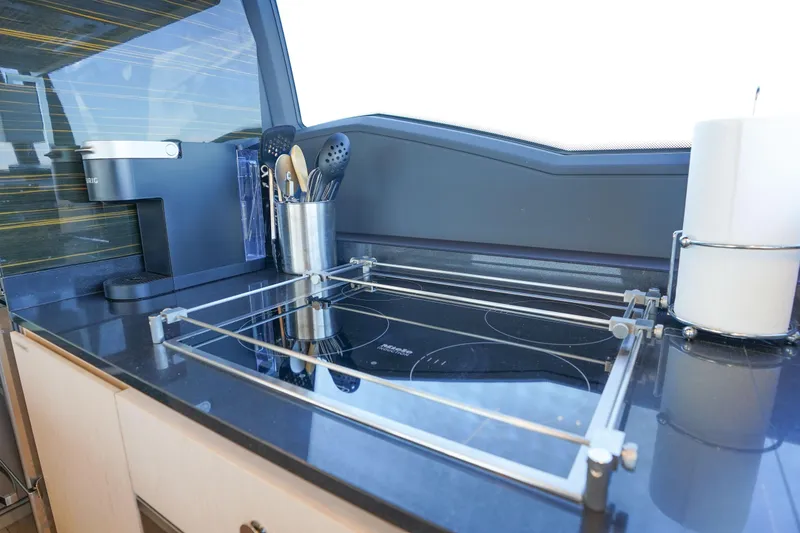 Slide: The Image of Modern kitchen area on 2017 Azimut 66 Flybridge yacht with sleek appliances. - 31