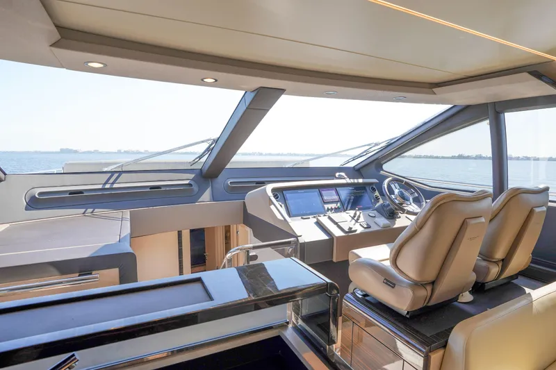 Slide: The Image of Luxurious interior of 2017 Azimut 66 Flybridge yacht with modern helm and leather seats. - 32
