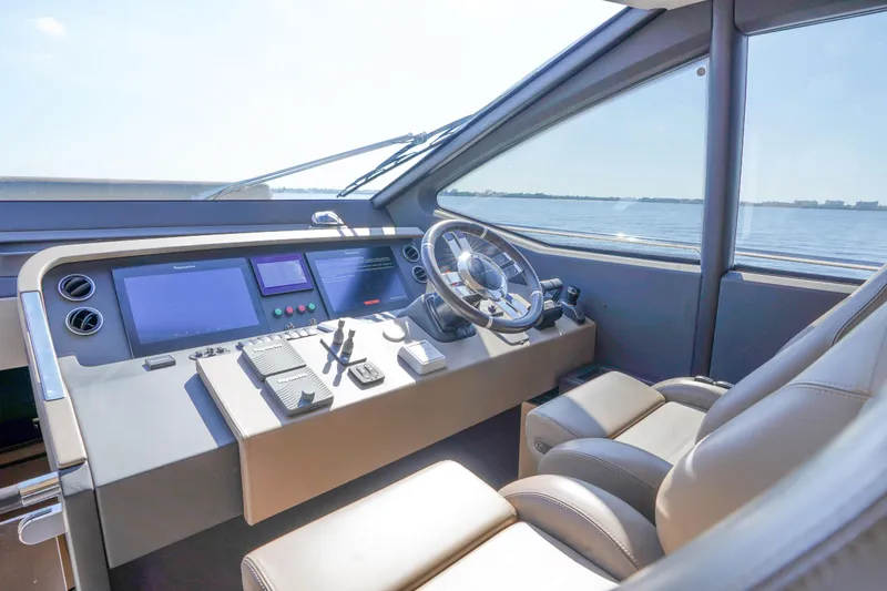 Slide: The Image of 2017 Azimut 66 Flybridge helm with modern controls and panoramic sea view. - 33