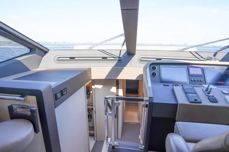 Slide: The Image of Interior view of 2017 Azimut 66 Flybridge yacht cockpit with modern controls and seating. - 35