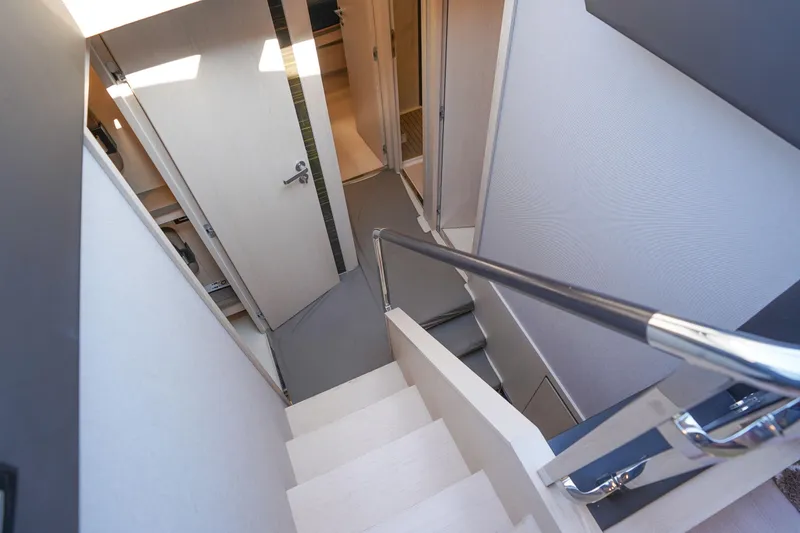 Slide: The Image of Staircase inside 2017 Azimut 66 Flybridge yacht, featuring sleek modern design. - 36