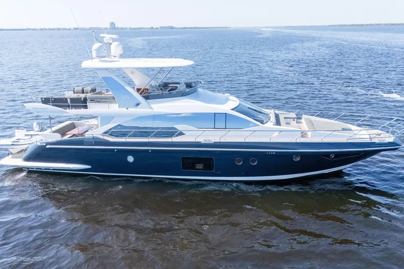 Slide: The Image of 2017 Azimut 66 Flybridge yacht cruising on open water. - 4