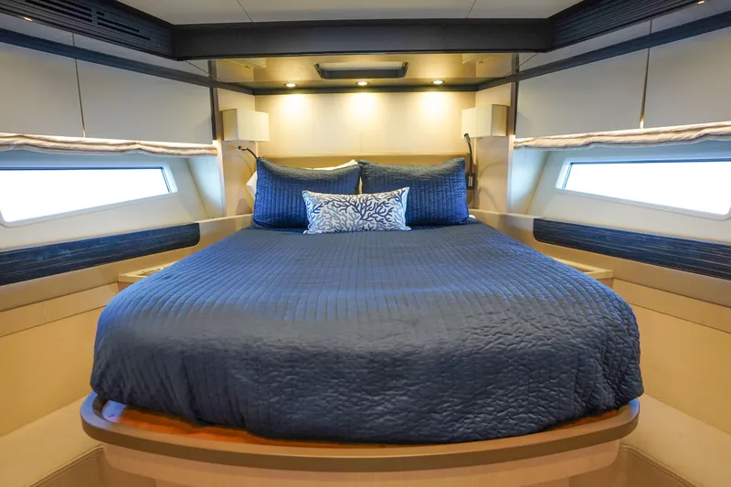 Slide: The Image of Luxurious bedroom interior of 2017 Azimut 66 Flybridge yacht with blue bedding. - 41