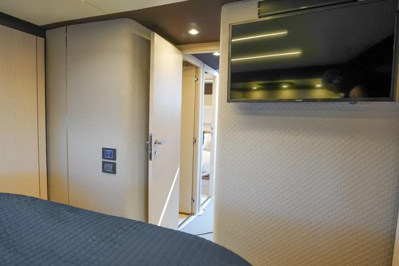 Slide: The Image of Luxurious interior of 2017 Azimut 66 Flybridge yacht with TV and modern decor. - 42