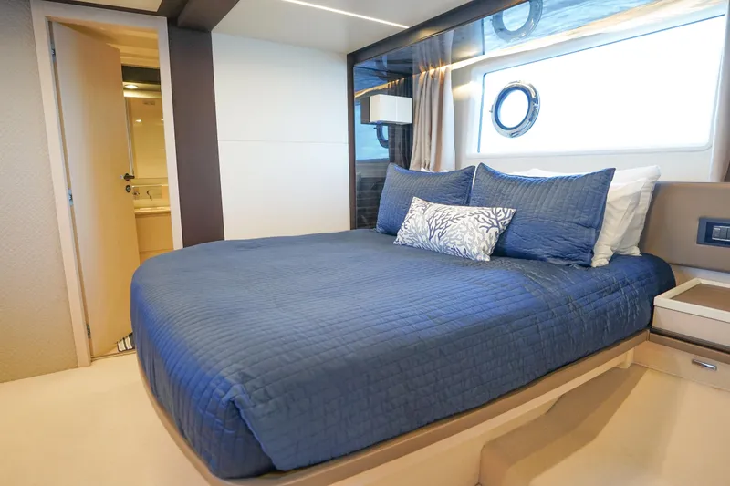 Slide: The Image of Luxurious bedroom interior of 2017 Azimut 66 Flybridge yacht with blue bedding. - 45