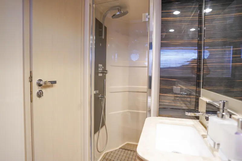 Slide: The Image of Luxurious bathroom in 2017 Azimut 66 Flybridge yacht with modern shower and sink. - 48