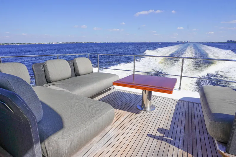 Slide: The Image of Luxurious 2017 Azimut 66 Flybridge yacht deck with ocean view and comfortable seating. - 49