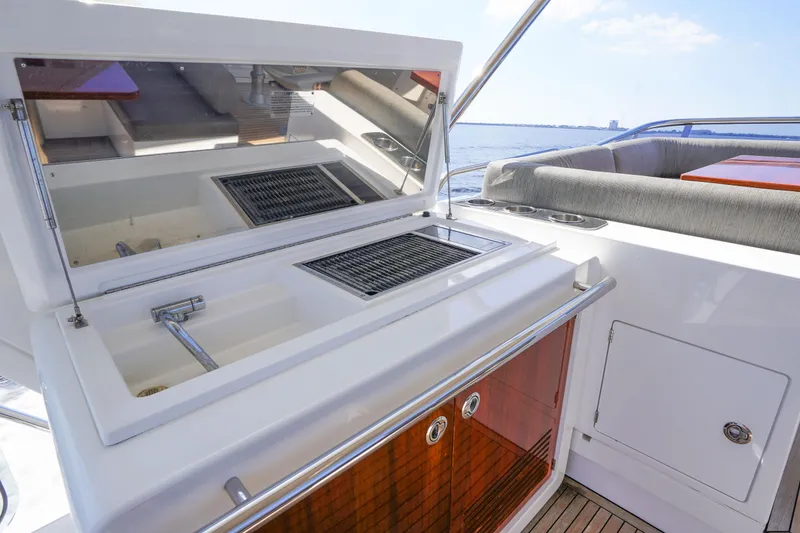 Slide: The Image of Outdoor kitchen on 2017 Azimut 66 Flybridge yacht with sink and grill. - 55