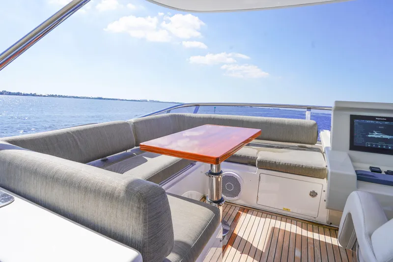 Slide: The Image of Luxurious 2017 Azimut 66 Flybridge yacht with elegant seating and ocean view. - 56