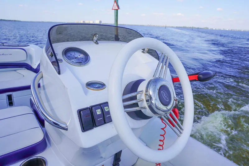 Slide: The Image of Steering wheel of 2017 Azimut 66 Flybridge yacht on open water. - 63