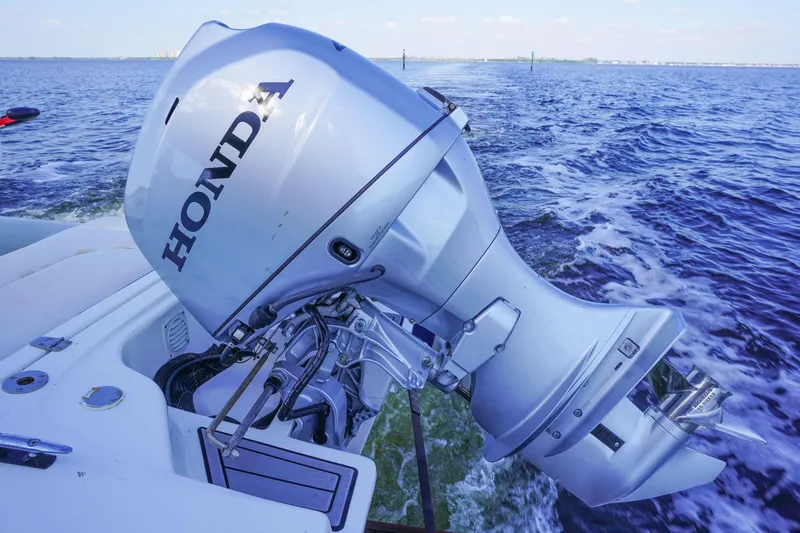 Slide: The Image of Honda outboard motor on Azimut 66 Flybridge yacht, 2017 model, cruising on open water. - 65