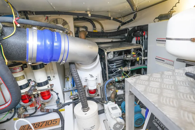 Slide: The Image of Engine room of 2017 Azimut 66 Flybridge yacht, showcasing mechanical components and systems. - 69