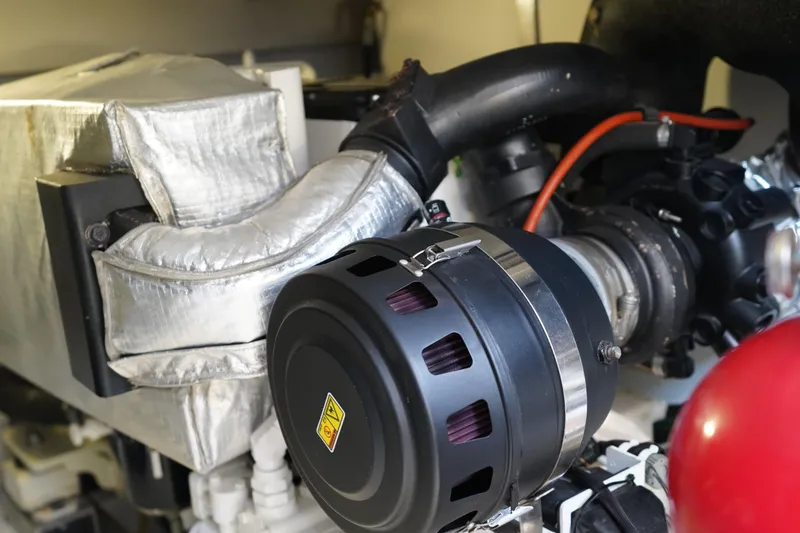 Slide: The Image of Engine compartment of 2017 Azimut 66 Flybridge yacht, showcasing mechanical components. - 70