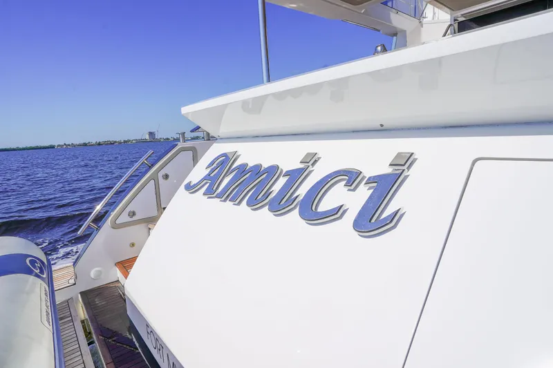 Slide: The Image of 2017 Azimut 66 Flybridge yacht "Amici" on water, rear view. - 8