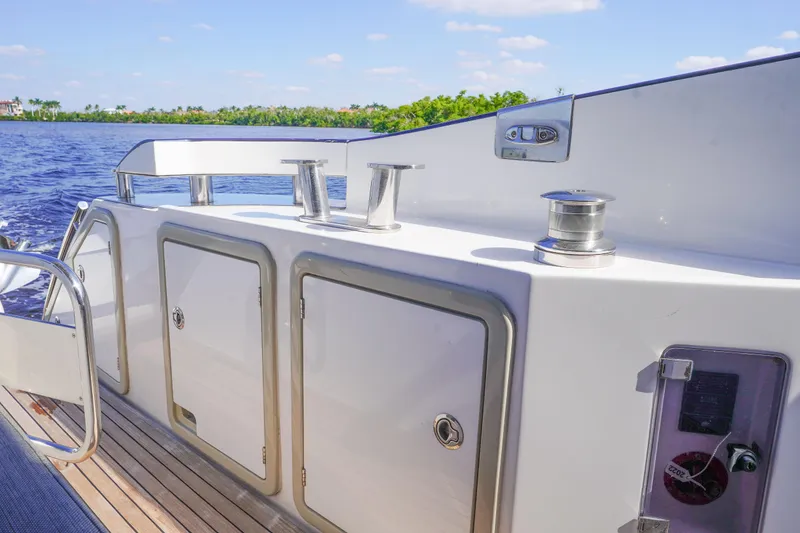 Slide: The Image of 2017 Azimut 66 Flybridge yacht deck with storage compartments and winches. - 9