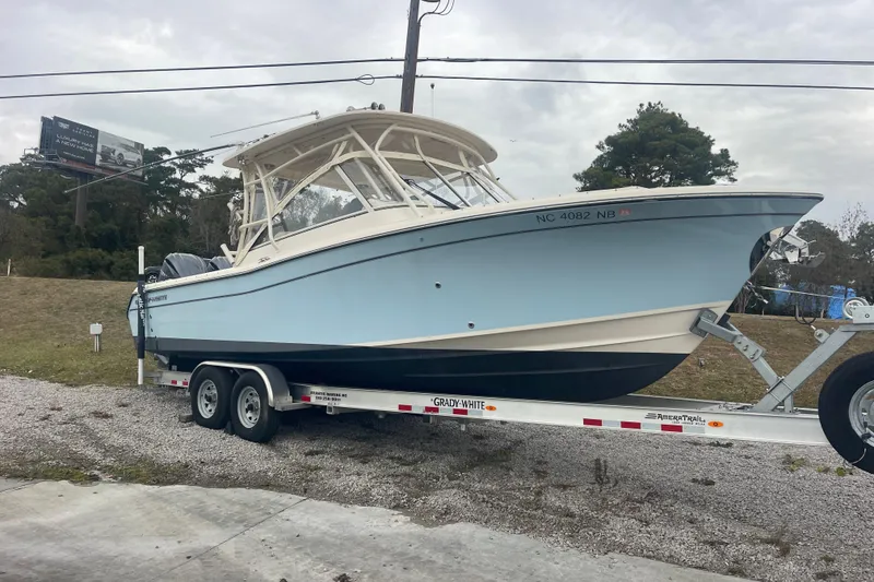 Slide: The Image of 2023 Grady-White Freedom 285 boat on trailer, parked outdoors. - 10