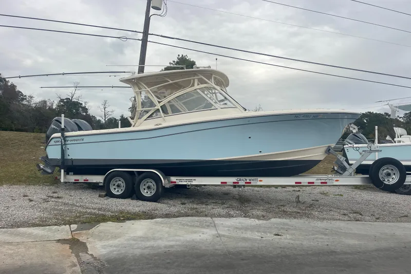 Slide: The Image of 2023 Grady-White Freedom 285 boat on trailer, parked outdoors. - 11