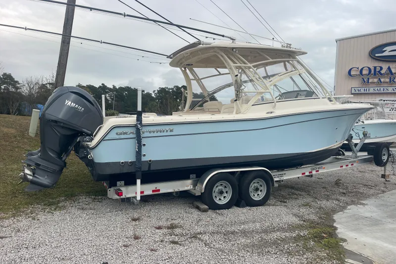 Slide: The Image of 2023 Grady-White Freedom 285 boat on trailer, featuring Yamaha outboard motor. - 12
