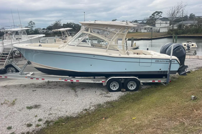 Slide: The Image of 2023 Grady-White Freedom 285 boat on trailer by waterfront. - 15