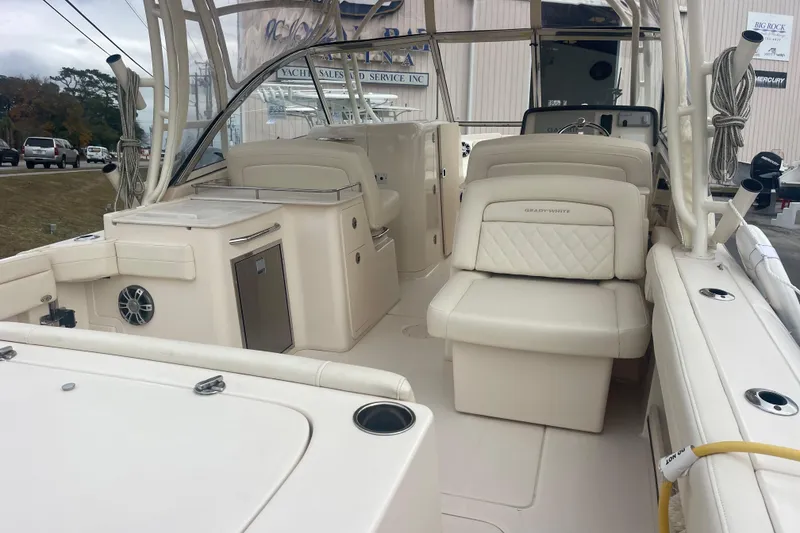 Slide: The Image of 2023 Grady-White Freedom 285 boat interior with seating and storage features. - 17