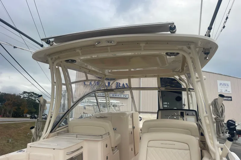 Slide: The Image of 2023 Grady-White Freedom 285 boat interior with helm and seating area. - 18