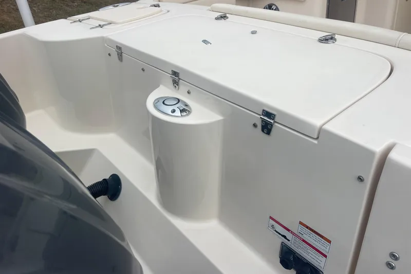Slide: The Image of 2023 Grady-White Freedom 285 boat deck with storage compartments and control panel. - 19