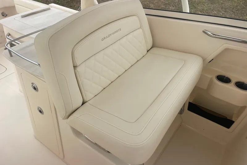 Slide: The Image of 2023 Grady-White Freedom 285 boat interior with luxurious seating and cup holders. - 30