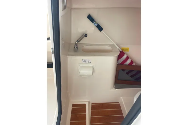Slide: The Image of 2023 Grady-White Freedom 285 boat interior with sink and storage area. - 32