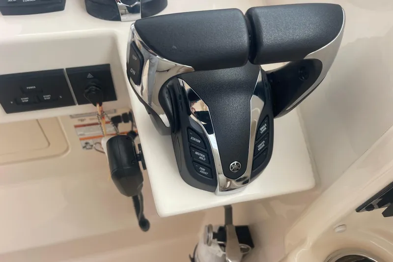 Slide: The Image of Throttle controls on a 2023 Grady-White Freedom 285 boat dashboard. - 41