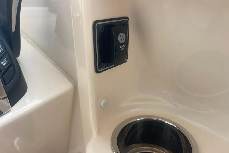 Slide: The Image of 2023 Grady-White Freedom 285 boat interior with power seat control and cup holder. - 42