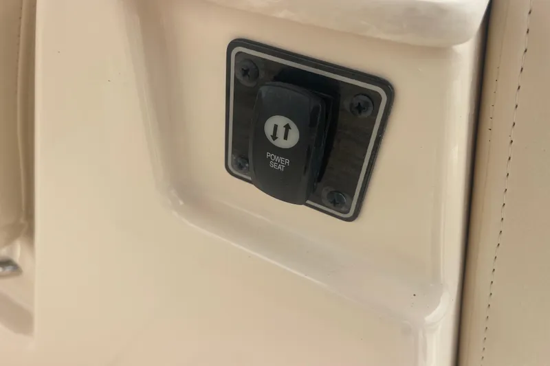 Slide: The Image of Power seat control on 2023 Grady-White Freedom 285 boat interior. - 46