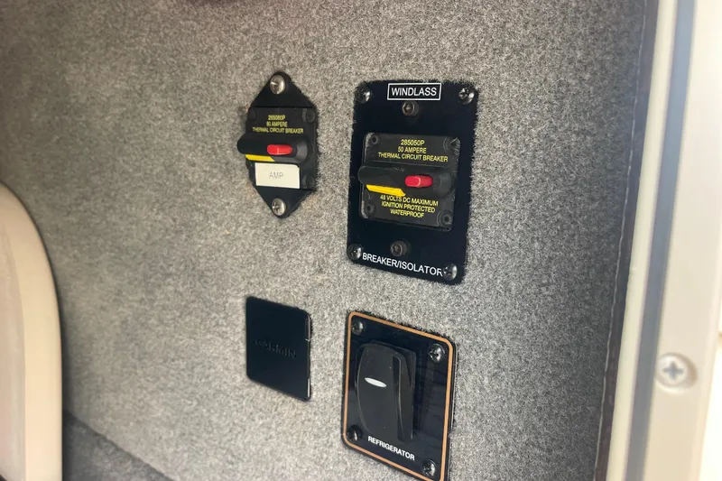 Slide: The Image of 2023 Grady-White Freedom 285 boat circuit breakers and controls panel. - 48