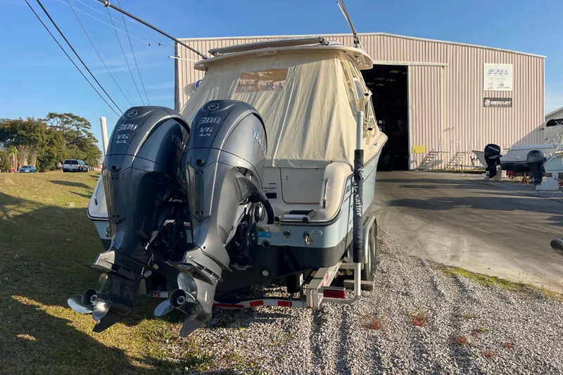 Slide: The Image of 2023 Grady-White Freedom 285 boat with twin Yamaha engines on a trailer. - 5