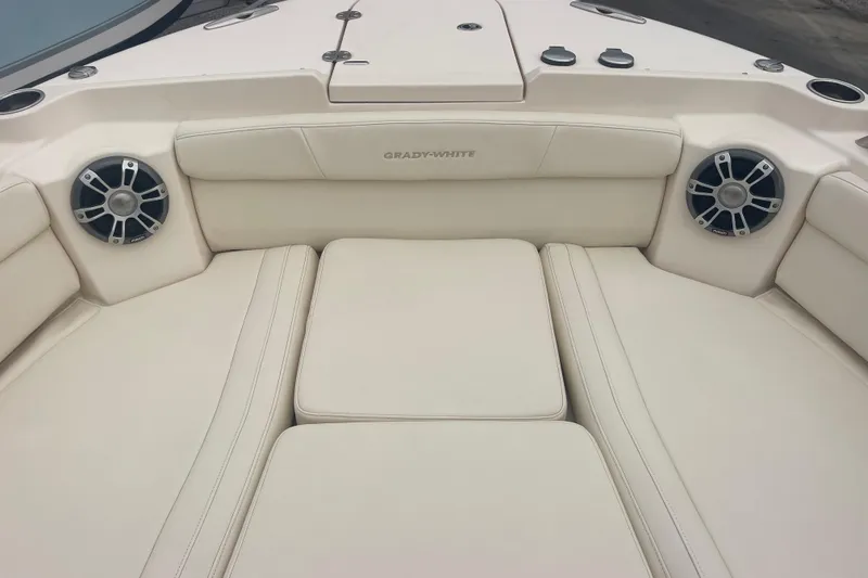Slide: The Image of 2023 Grady-White Freedom 285 boat interior with cushioned seating and speakers. - 51