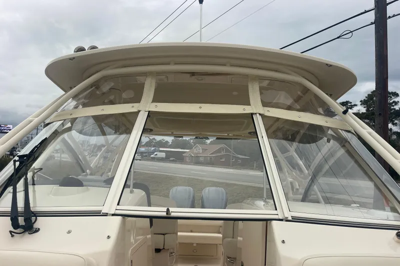 Slide: The Image of 2023 Grady-White Freedom 285 boat with clear windshield and spacious interior. - 53