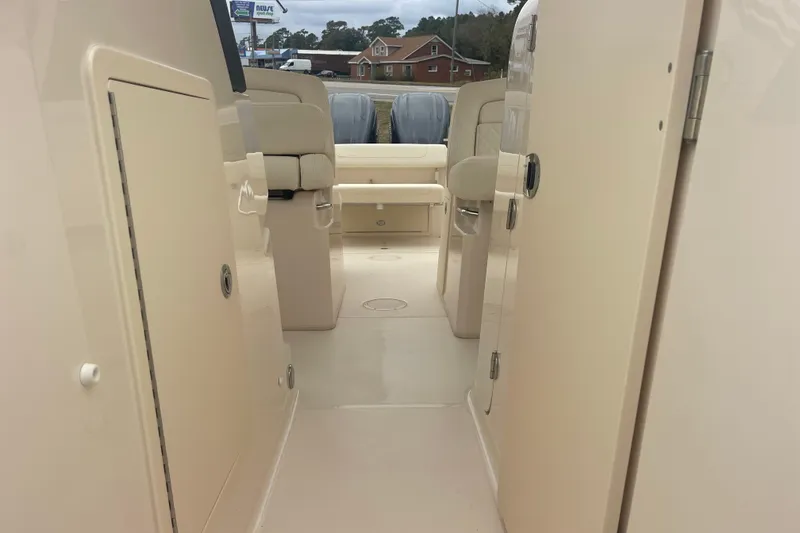 Slide: The Image of 2023 Grady-White Freedom 285 boat interior, showcasing seating and storage compartments. - 54