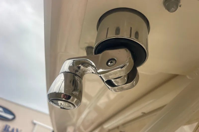 Slide: The Image of Close-up of a 2023 Grady-White Freedom 285 boat's chrome fitting detail. - 59