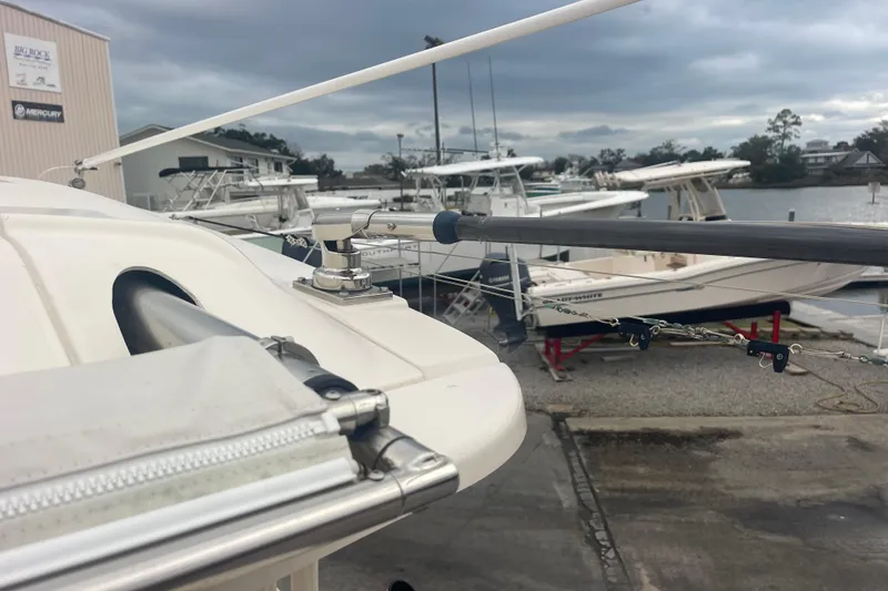 Slide: The Image of 2023 Grady-White Freedom 285 boat docked, showcasing sleek design and marina setting. - 61