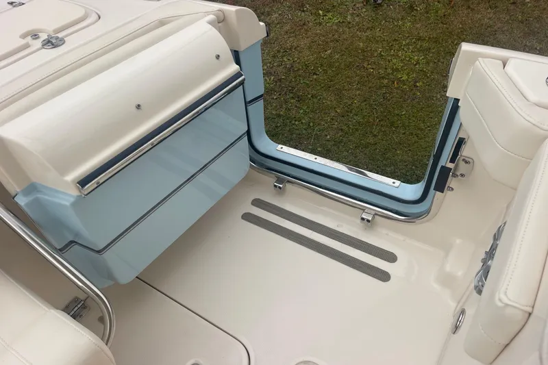Slide: The Image of 2023 Grady-White Freedom 285 boat interior with open hatch and seating area. - 64