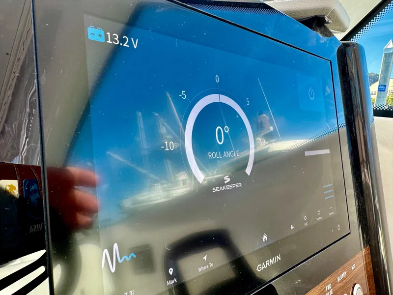 Slide: The Image of Garmin display on 2025 Tiara Yachts 34 LX showing roll angle and voltage. - 33