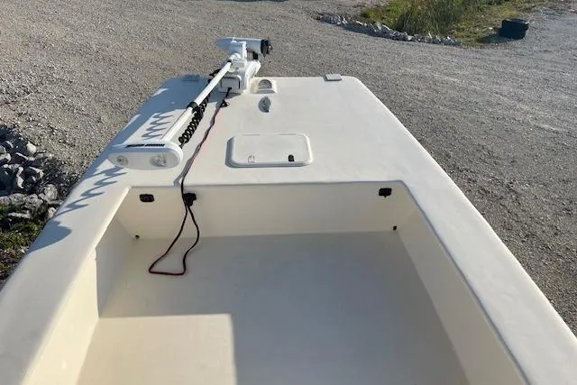 Slide: The Image of 2019 Jones Brothers 17 BATEAU boat with trolling motor on gravel surface. - 2
