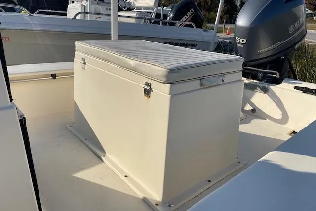 Slide: The Image of 2019 Jones Brothers 17 BATEAU boat interior with cushioned storage seat and Yamaha outboard motor. - 4