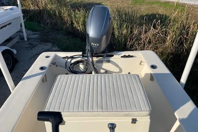 Slide: The Image of 2019 Jones Brothers 17 BATEAU boat with outboard motor and cushioned seating. - 5