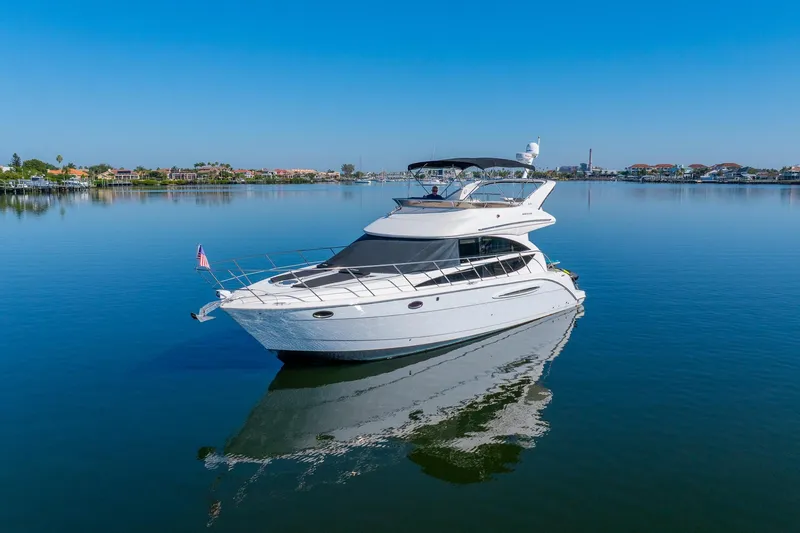 The Image of 2009 Meridian 391 Sedan yacht on calm water with clear blue sky. - 0