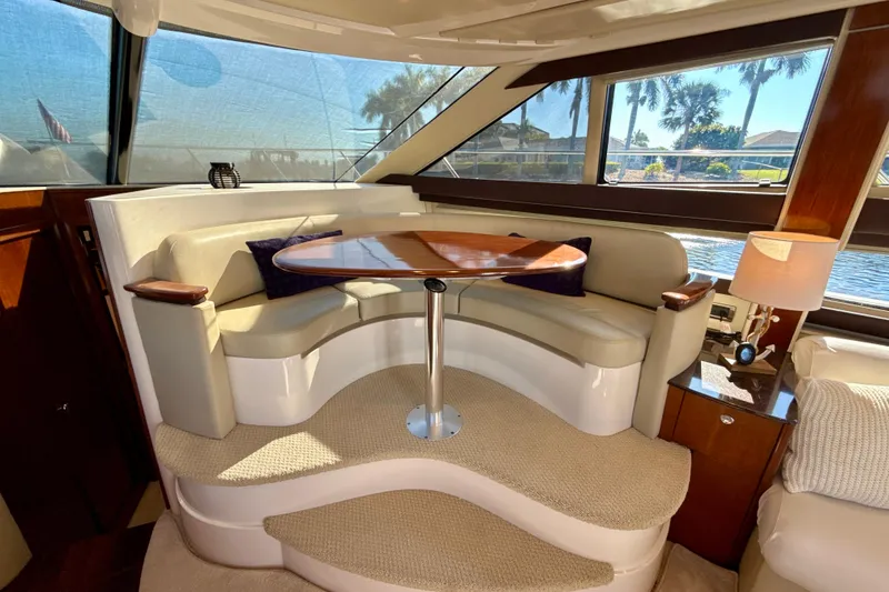 Slide: The Image of Luxurious interior of 2009 Meridian 391 Sedan yacht with elegant seating and table. - 13