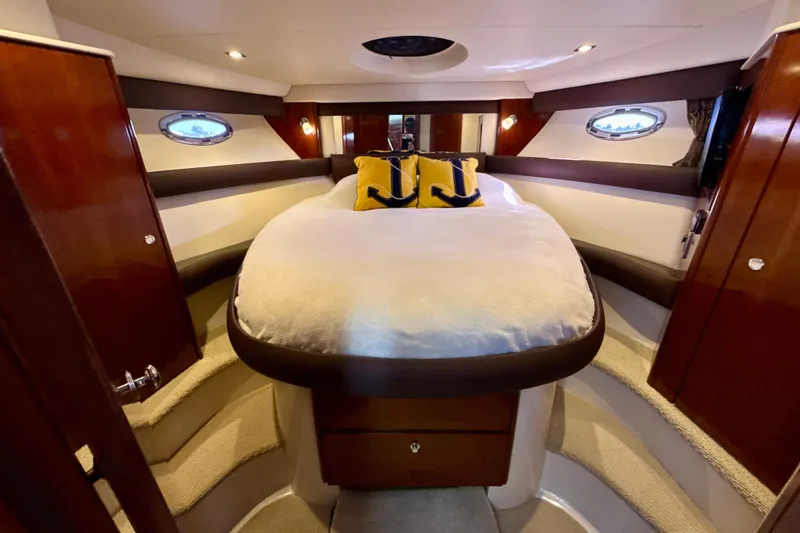 Slide: The Image of Luxurious bedroom interior of 2009 Meridian 391 Sedan yacht with elegant wood finishes. - 14
