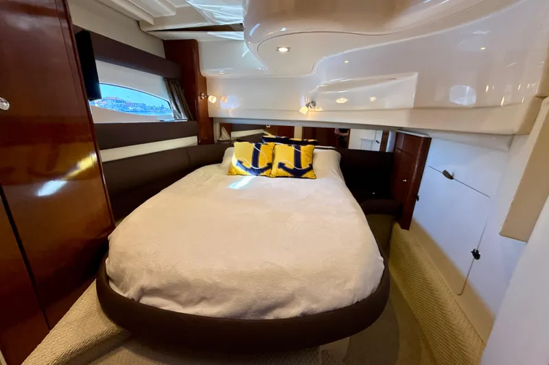Slide: The Image of Luxurious bedroom interior of 2009 Meridian 391 Sedan yacht with cozy bedding. - 21