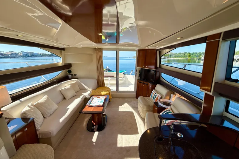 Slide: The Image of Luxurious interior of a 2009 Meridian 391 Sedan yacht with elegant seating and scenic water views. - 27