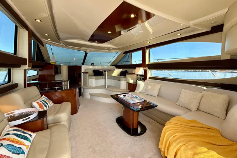Slide: The Image of Luxurious interior of a 2009 Meridian 391 Sedan yacht with elegant seating and panoramic windows. - 3